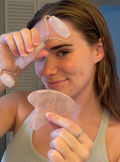 Aurevia Bliss face massager roller guasha tool for skincare, showing a close-up of the facial massage stone and ergonomic handle.