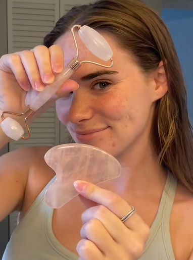 Aurevia Bliss face massager roller guasha tool for skincare, showing a close-up of the facial massage stone and ergonomic handle.